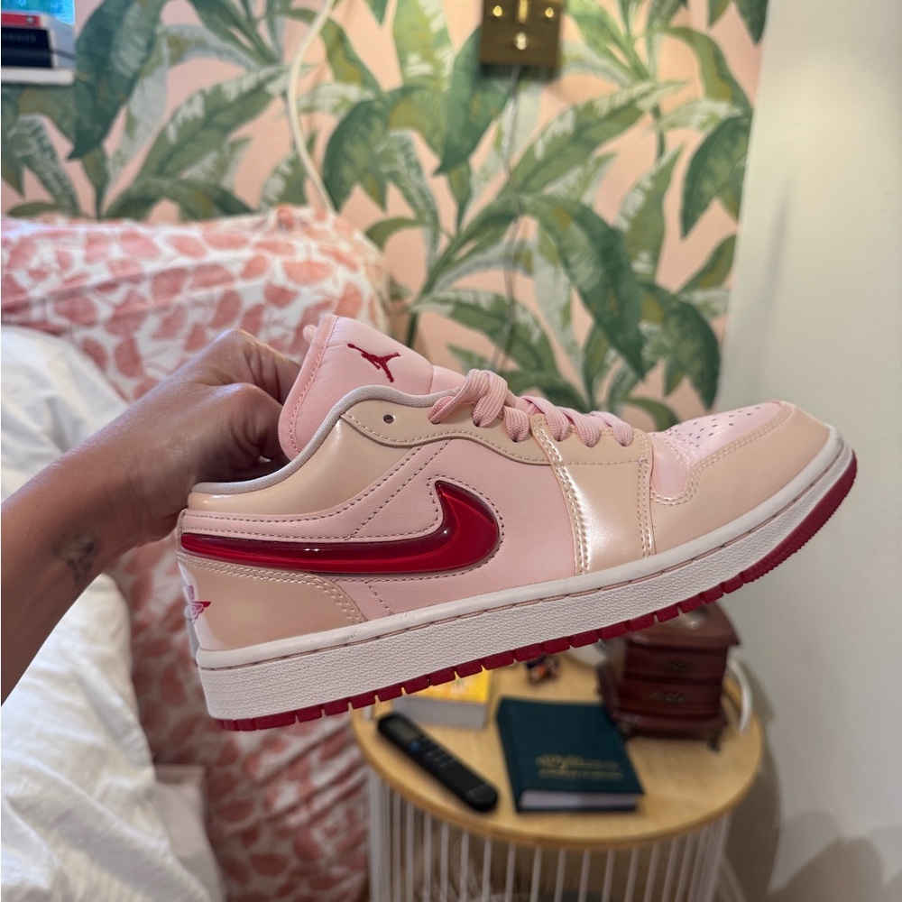 Jordan Women's Low Top Sneaker in Light Pink with Red Swoosh
